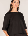 P.CILL Hazel Overlap Back Top in black, front view, worn with black wide-leg pants