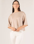 P.CILL Hazel Overlap Back Top in taupe, front view, worn with white jeans
