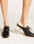 Stivali Focus black leather lace-up loafers on model, front angle