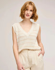 Gentle Fawn Tanner Knit Vest in cream with tan stripes worn with cream trousers, front view