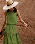 dRA Maya tiered midi skirt in green worn with the matching Aviana top and a straw hat