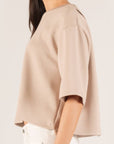 Close side view of the taupe P.CILL Hazel top with dropped shoulder and three-quarter sleeve