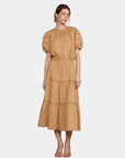 Camel signature blouse and tiered midi skirt styled together