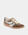 Front angled view of the Dolce Vita Merit Leopard Sneakers showcasing leopard calf hair, suede overlays, leather side stripes, and a gum rubber sole.