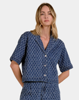 Front view of the Elan Dara Diamond Denim Top styled with the matching wide leg jeans