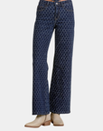 Detail view of Elan Diamond high rise wide leg jeans showing the diamond denim pattern