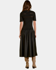 Back view of the Elan Ember mixed media midi dress in black with open-knit yoke detailing and full skirt.