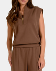 Close-up of the Elan Marley mocha sleeveless pullover showing the stand collar and gold-tone quarter-zip detail.