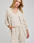 Model wearing Gentle Fawn Portia linen shirt and Finley linen pants matching set in neutral stripe