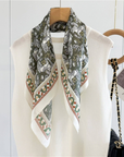 Greek Horse Mulberry Silk Scarf draped around the neck over an ivory top