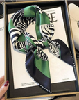 Green zebra print mulberry silk scarf styled around the neck