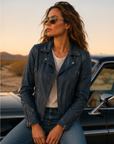 Women's Mauritius Christy navy lambskin leather jacket with signature star detailing, modeled outdoors in a lifestyle setting.