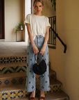 Monaco Pearl Trim Tee styled with pearl detail straight leg jeans for a chic coordinated women's outfit.