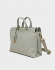 Montemare Vienna Small Carry On Tote in Blakes Blue angled view with top handles, shoulder strap and gold hardware