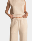 Detail of the P.CILL Lula Butter Modal Wide Leg Pants in Oatmeal showing the elastic waistband and contrast side stripe