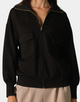 Front detail of the P.CILL Reid Butter Modal™ Utility Jacket in Black with zip closure and utility pockets