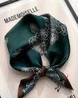 Painted totems mulberry silk scarf styled around the neck