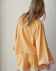 Resort embroidered puff sleeve top back view showing silhouette and fabric detail