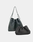 Sloane woven vegan leather hobo bag in black featuring slouchy silhouette and woven texture on a neutral background.