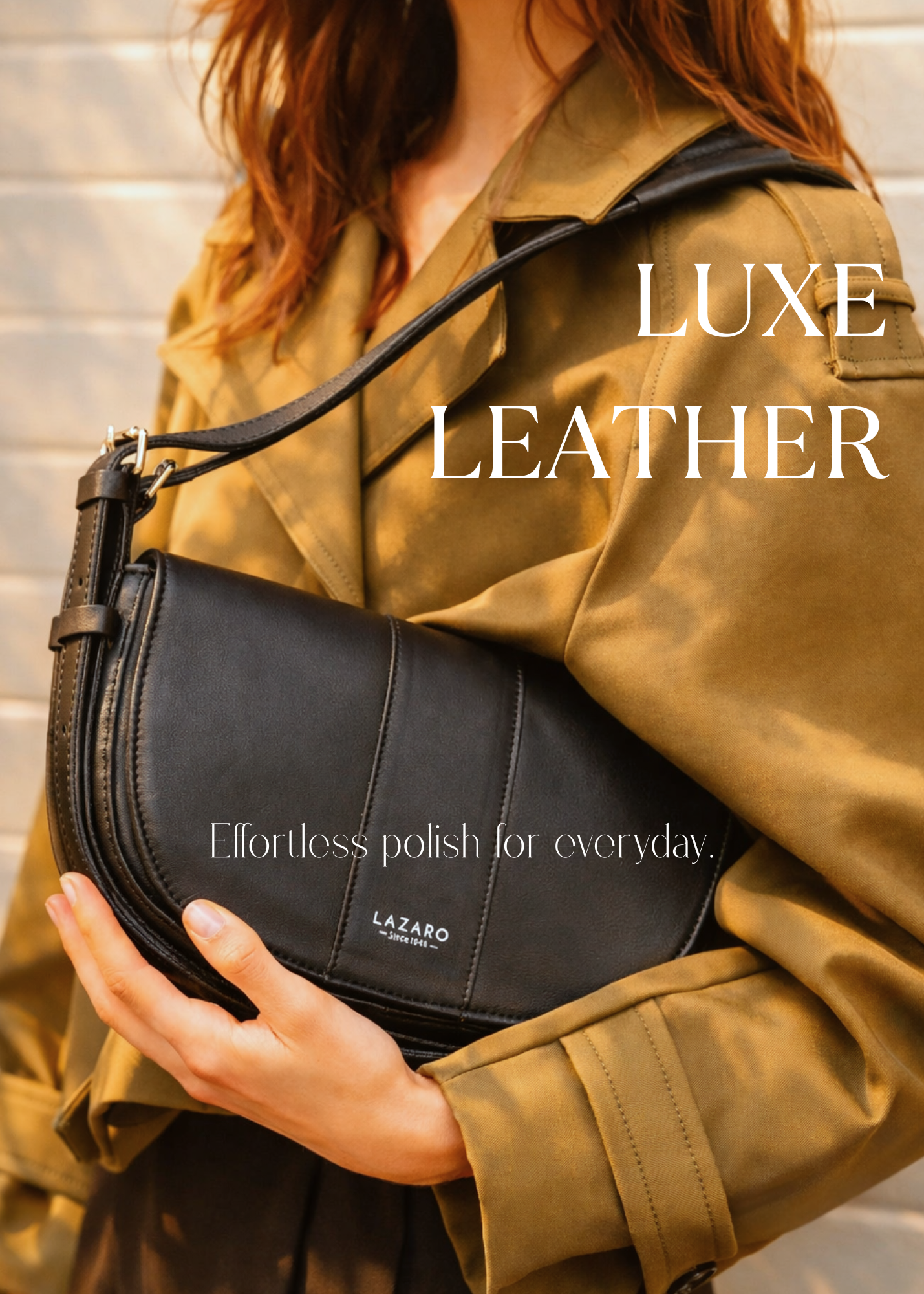 Model wearing an olive trench coat holding a black Lazaro Sisa crossbody handbag with a structured silhouette and adjustable shoulder strap.