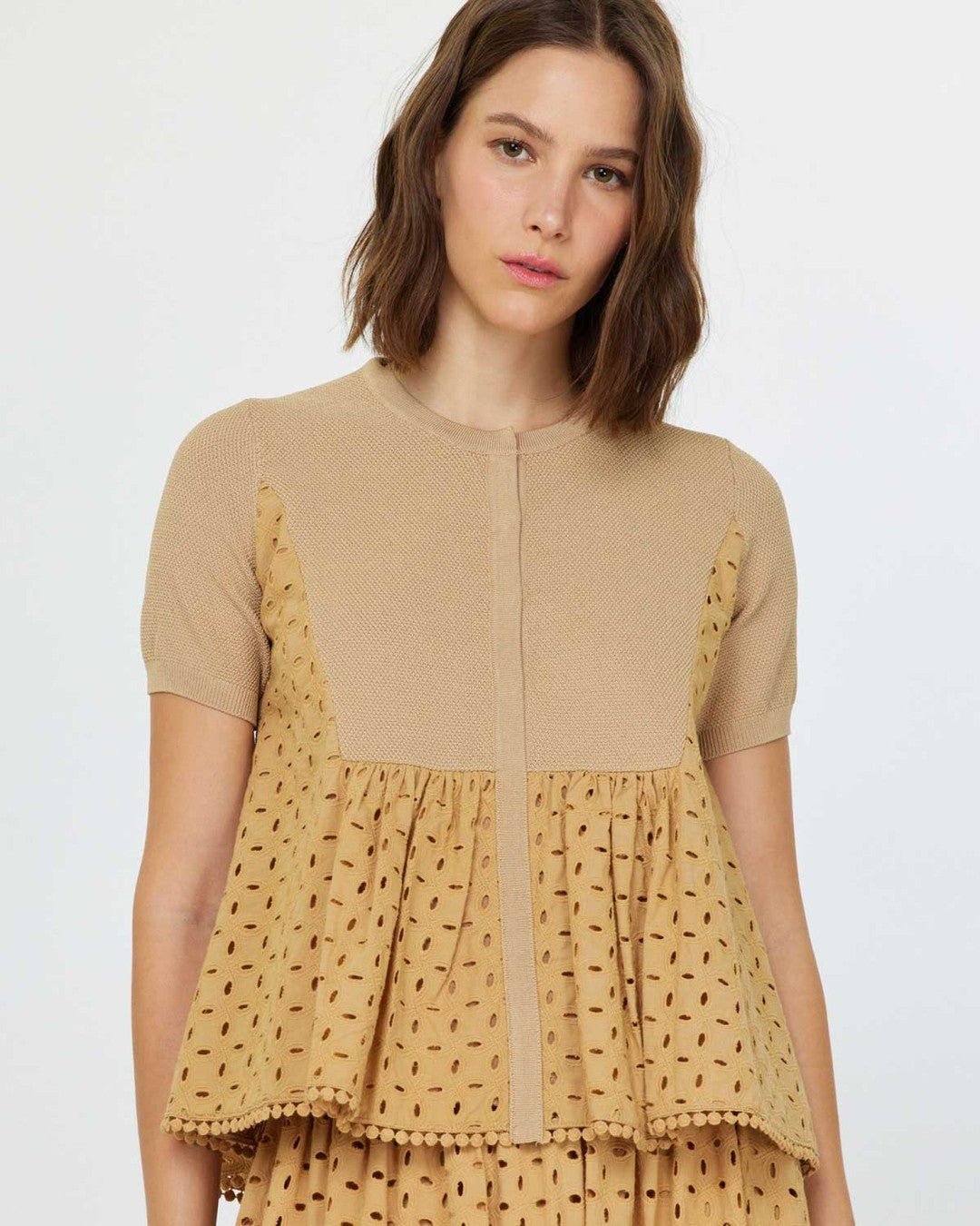 Current Air Butterscotch Eyelet Blouse with knit yoke and eyelet peplum, worn over the matching skirt