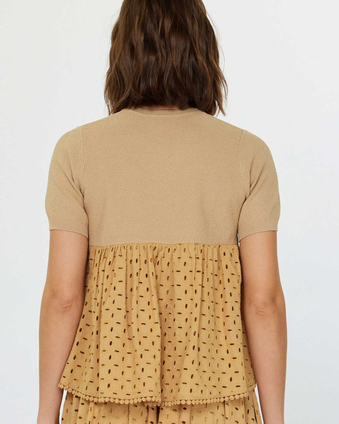 Back view of the Current Air Butterscotch Eyelet Blouse with knit back yoke and eyelet peplum