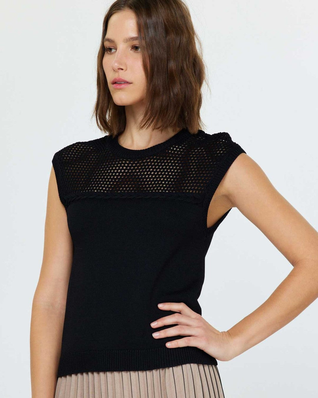 Three-quarter view of the black Stitched Sleeveless Sweater showing the netted yoke and cap sleeves