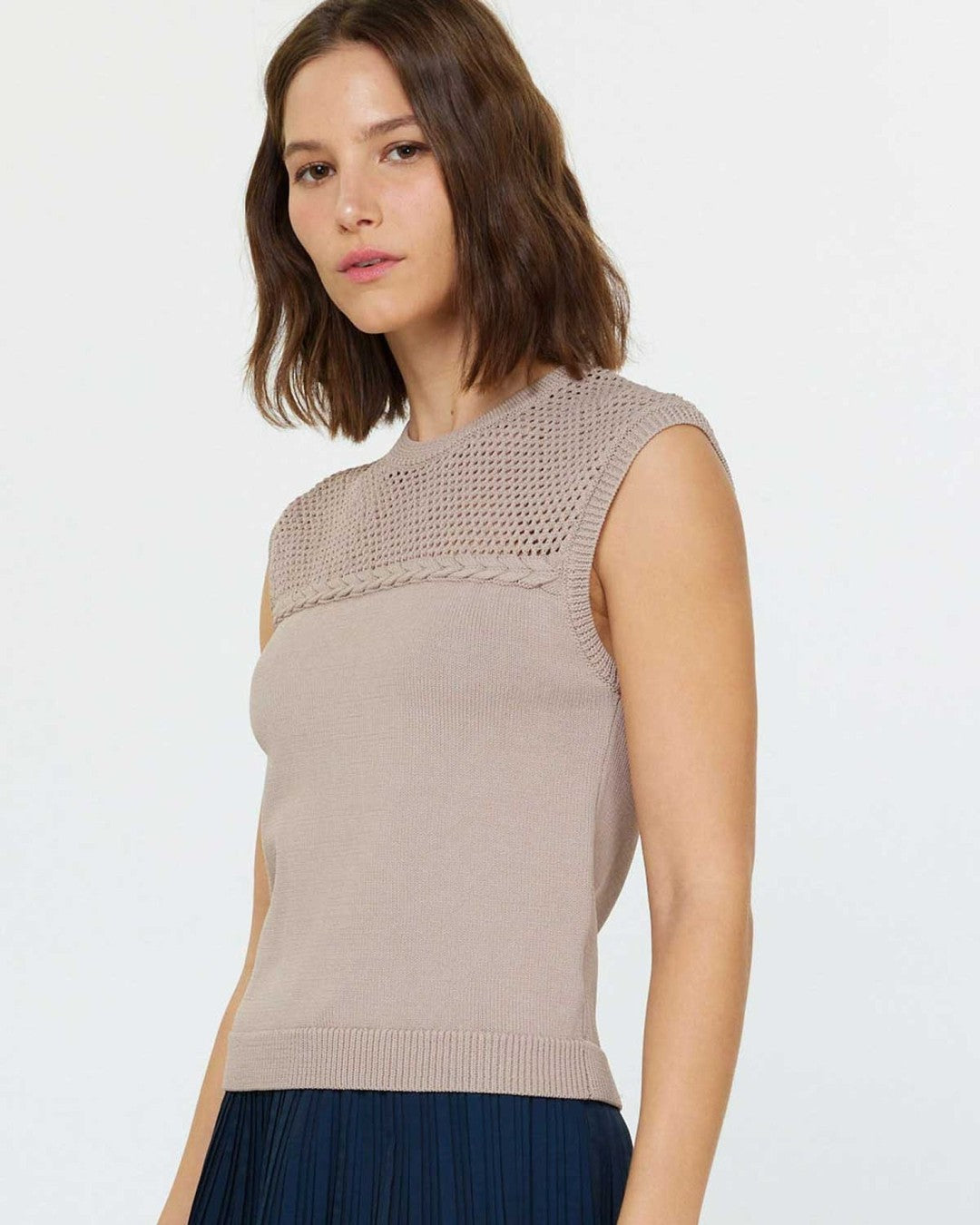 Three-quarter view of the mocha Stitched Sleeveless Sweater showing the braided band below the netted yoke