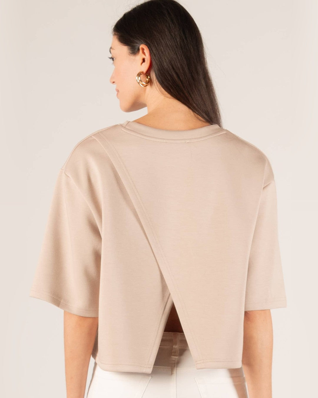 Back view of the taupe Hazel top showing the overlapping split back panels