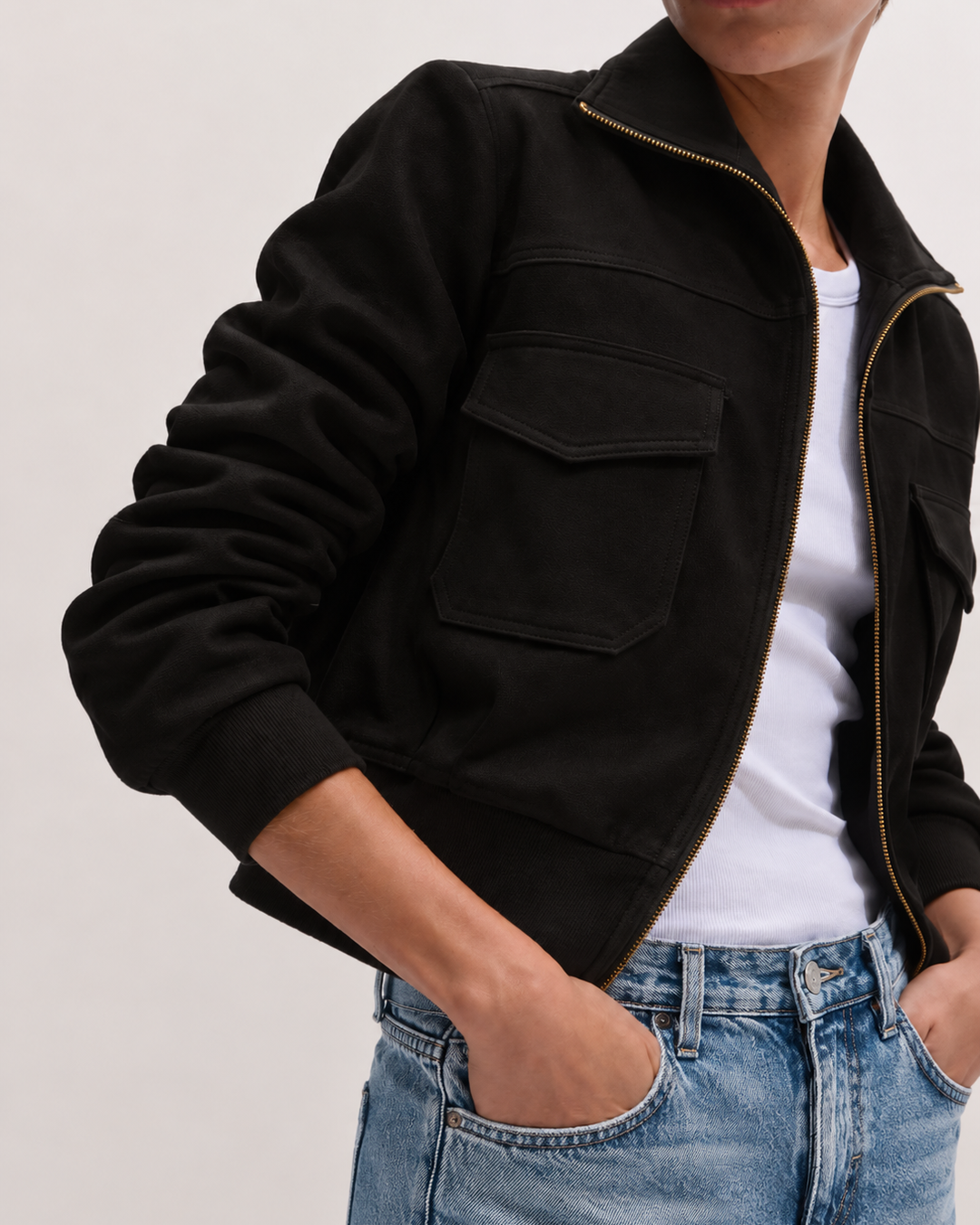 Model wearing the P.CILL Reid Utility Jacket in Black unzipped over a white tee with light wash jeans, showing chest flap pockets
