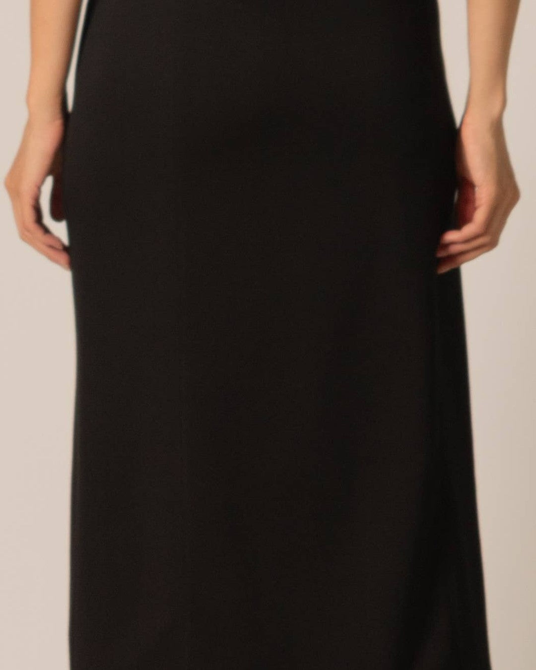 Close-up of the smooth black Butter Modal fabric and seamed front of the midi skirt