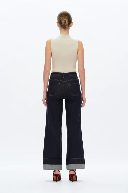 model wearing BAYEAS high-rise wide-leg Rolle jeans in dark wash full length