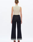 model wearing BAYEAS high-rise wide-leg Rolle jeans in dark wash full length