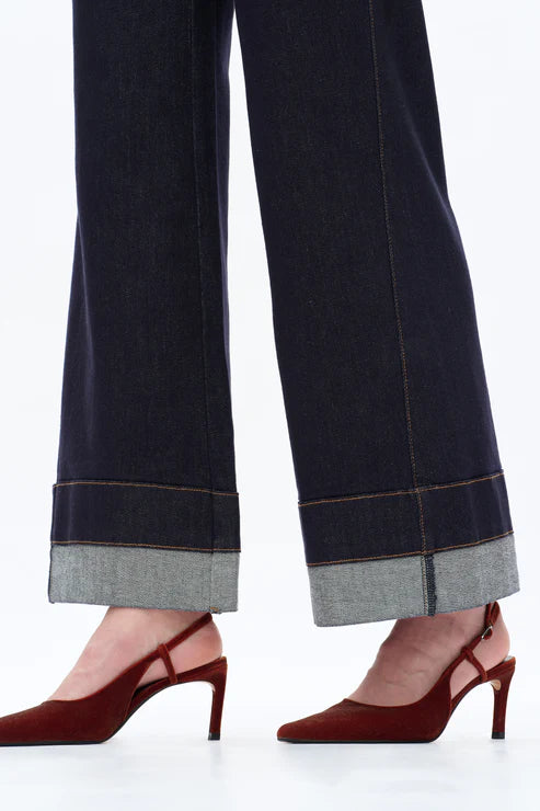 close-up of BAYEAS Rolle jeans showing rolled cuff hem detail in dark denim