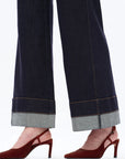 close-up of BAYEAS Rolle jeans showing rolled cuff hem detail in dark denim