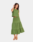 Model wearing D.RA Aviana green textured sleeveless top with subtle ruffle trim and cropped silhouette.