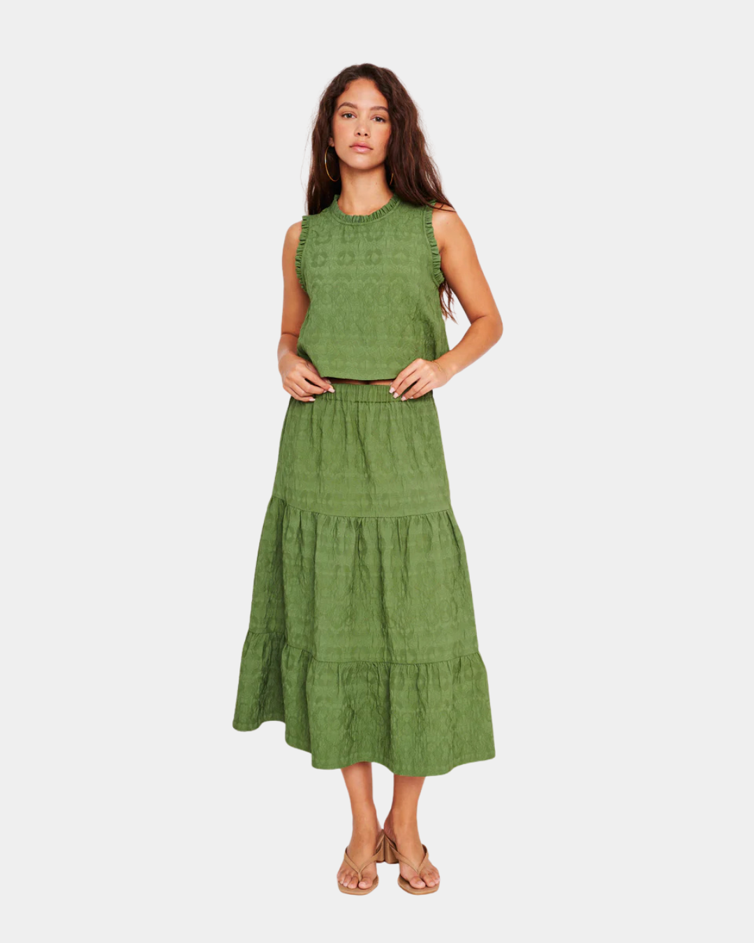 Model styled in D.RA Aviana top paired with D.RA Maya green tiered midi skirt for a chic matching set look.
