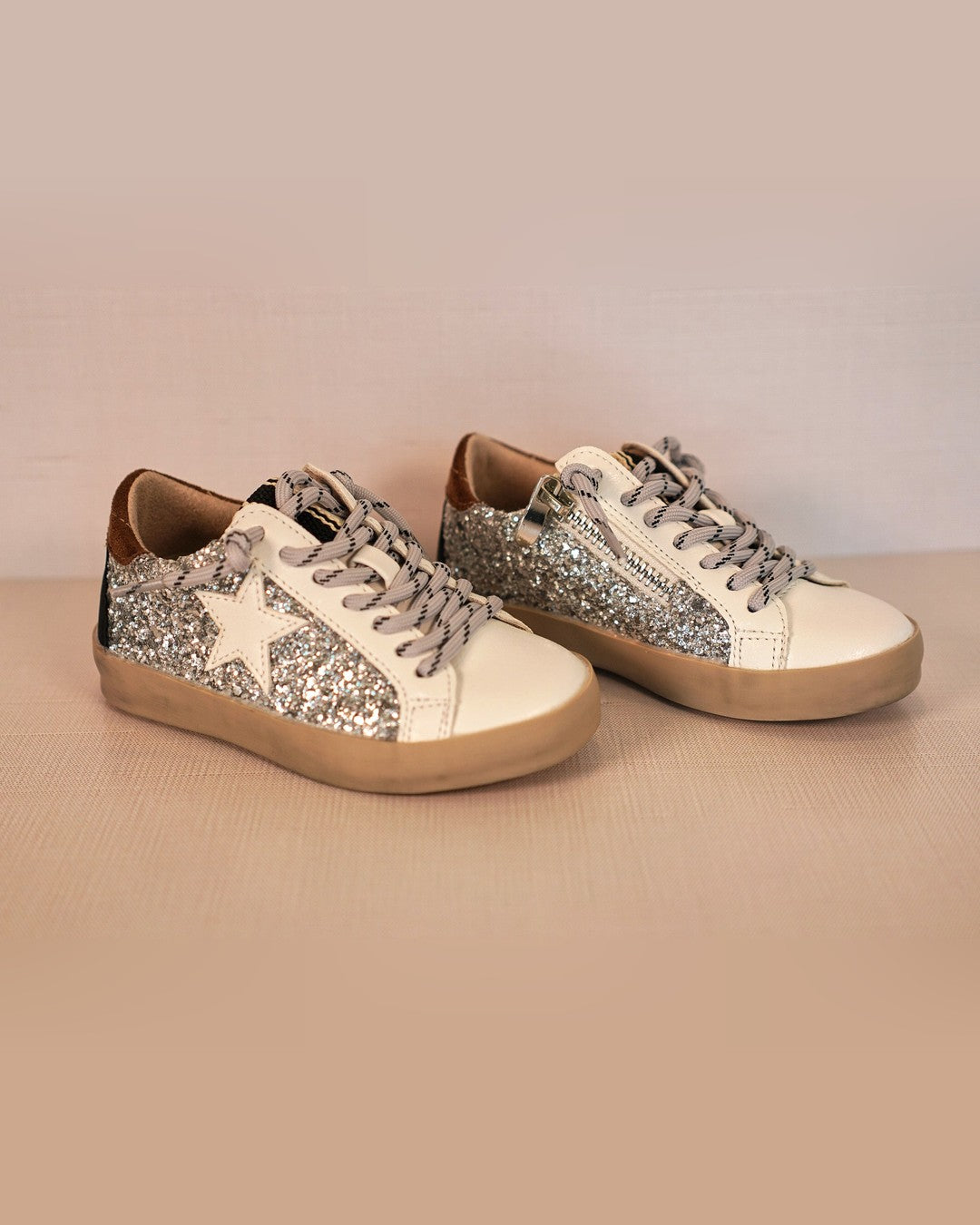 Pair of Shushop Paula toddler sneakers in silver glitter with white stars
