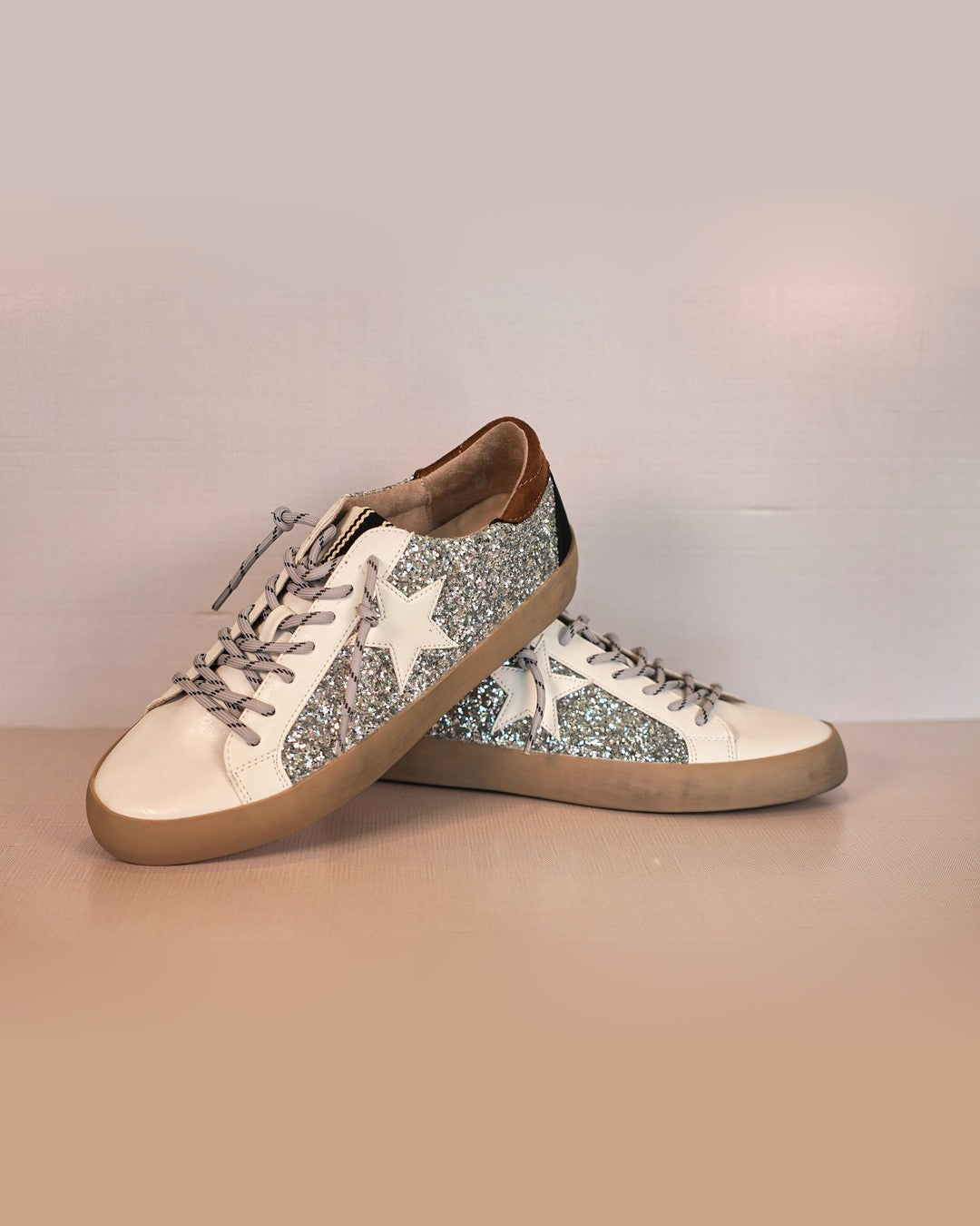 Pair of Shushop Paula Glitter Sneakers with silver glitter and white stars