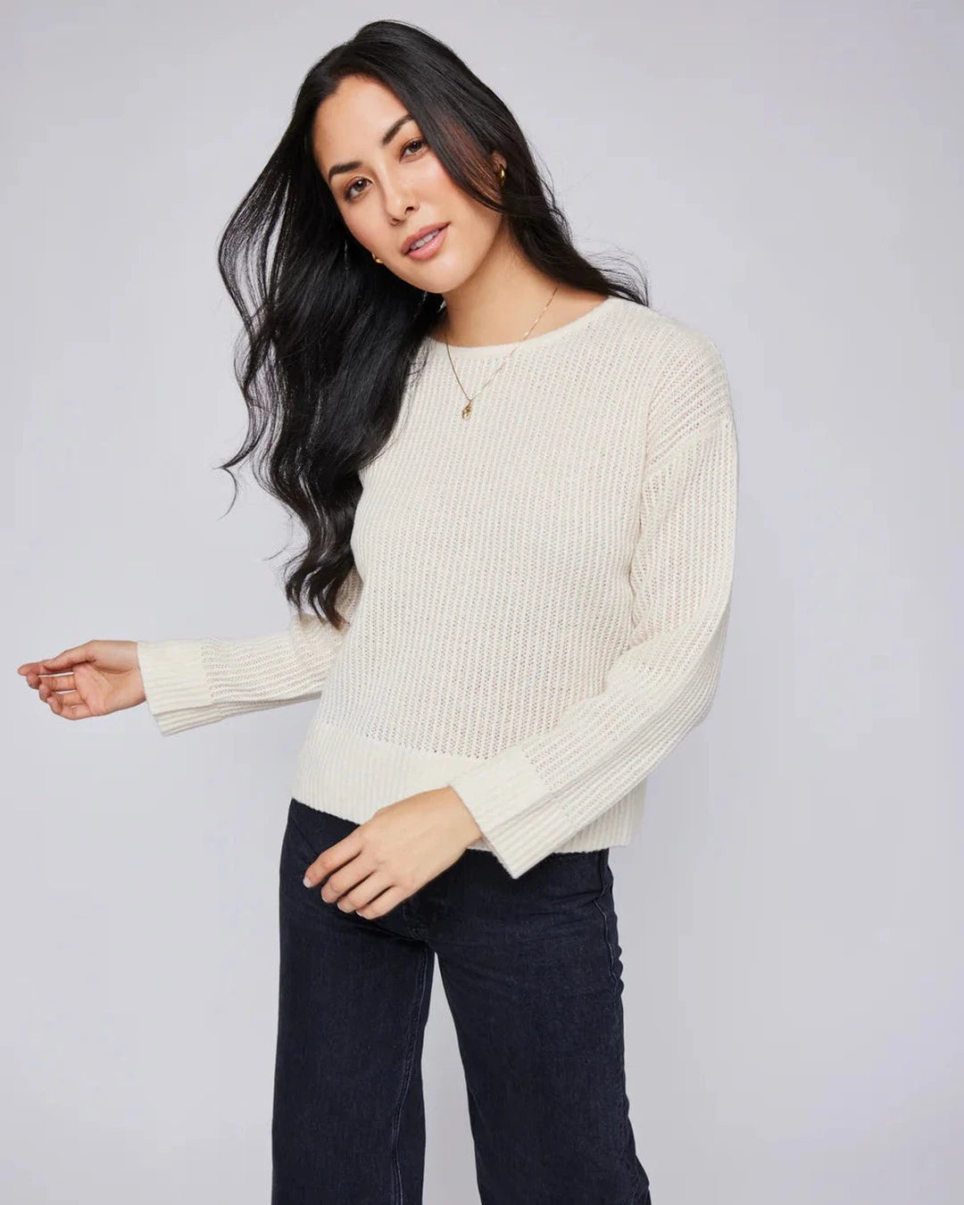 Gentle Fawn Ambrose cream pointelle sweater, angled front view on model