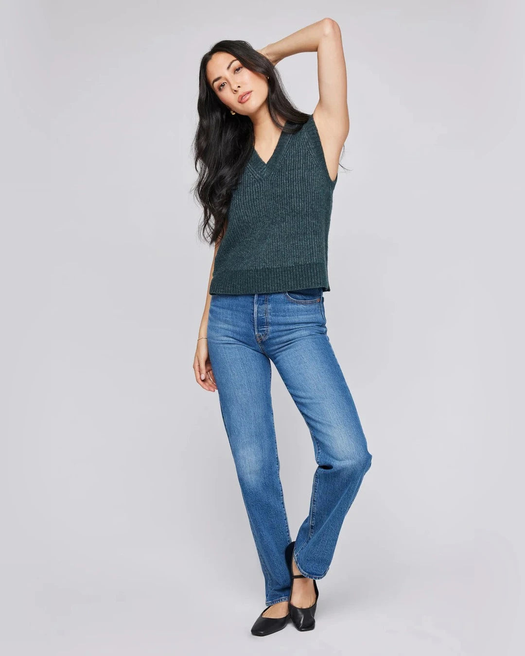 Gentle Fawn Peyton Sweater Vest in forest green worn with straight-leg jeans and black flats, front view