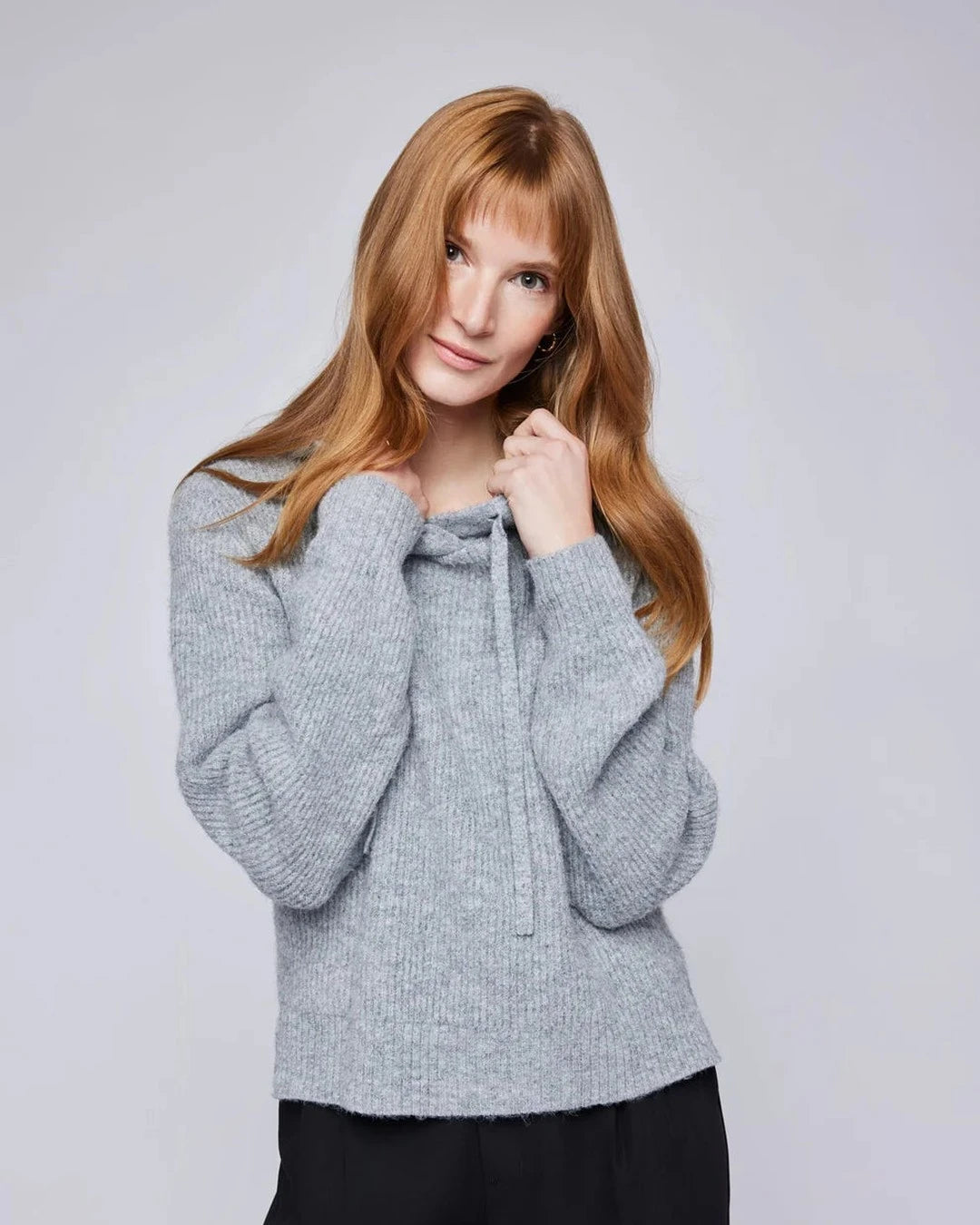 Gentle Fawn Alanis Pullover Sweater in heather grey with the hood down, worn with black trousers