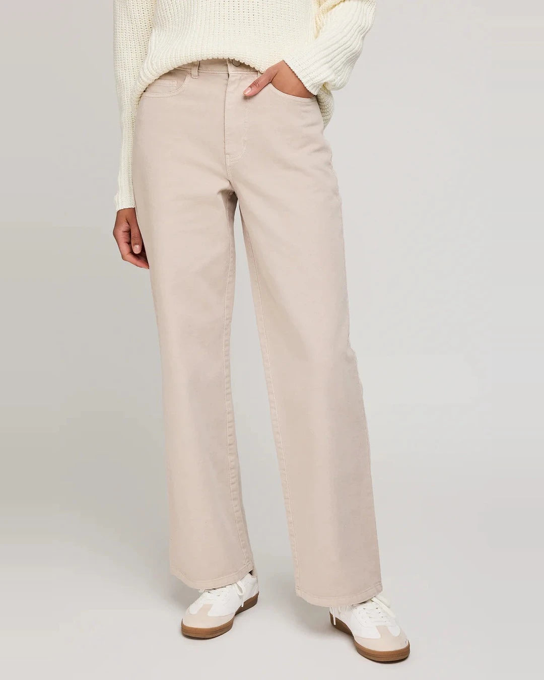 Gentle Fawn Everett wide-leg pants in pebble, a light stone color, worn with white sneakers