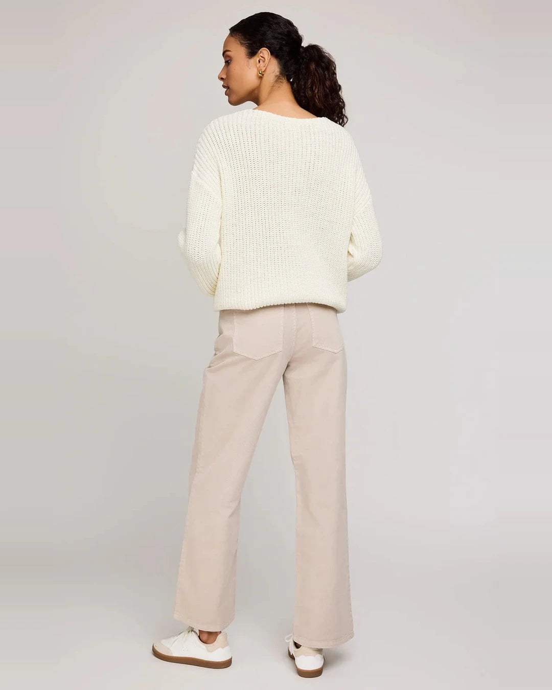 Back view of the Everett wide-leg pants in pebble with a cream knit sweater