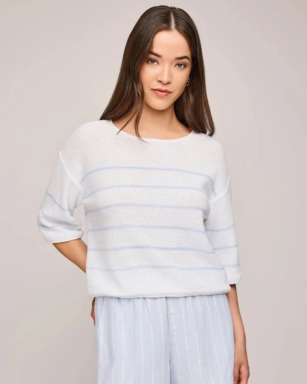 Gentle Fawn Kerrigan Sweater in white with sky blue stripes worn with striped shorts, front view
