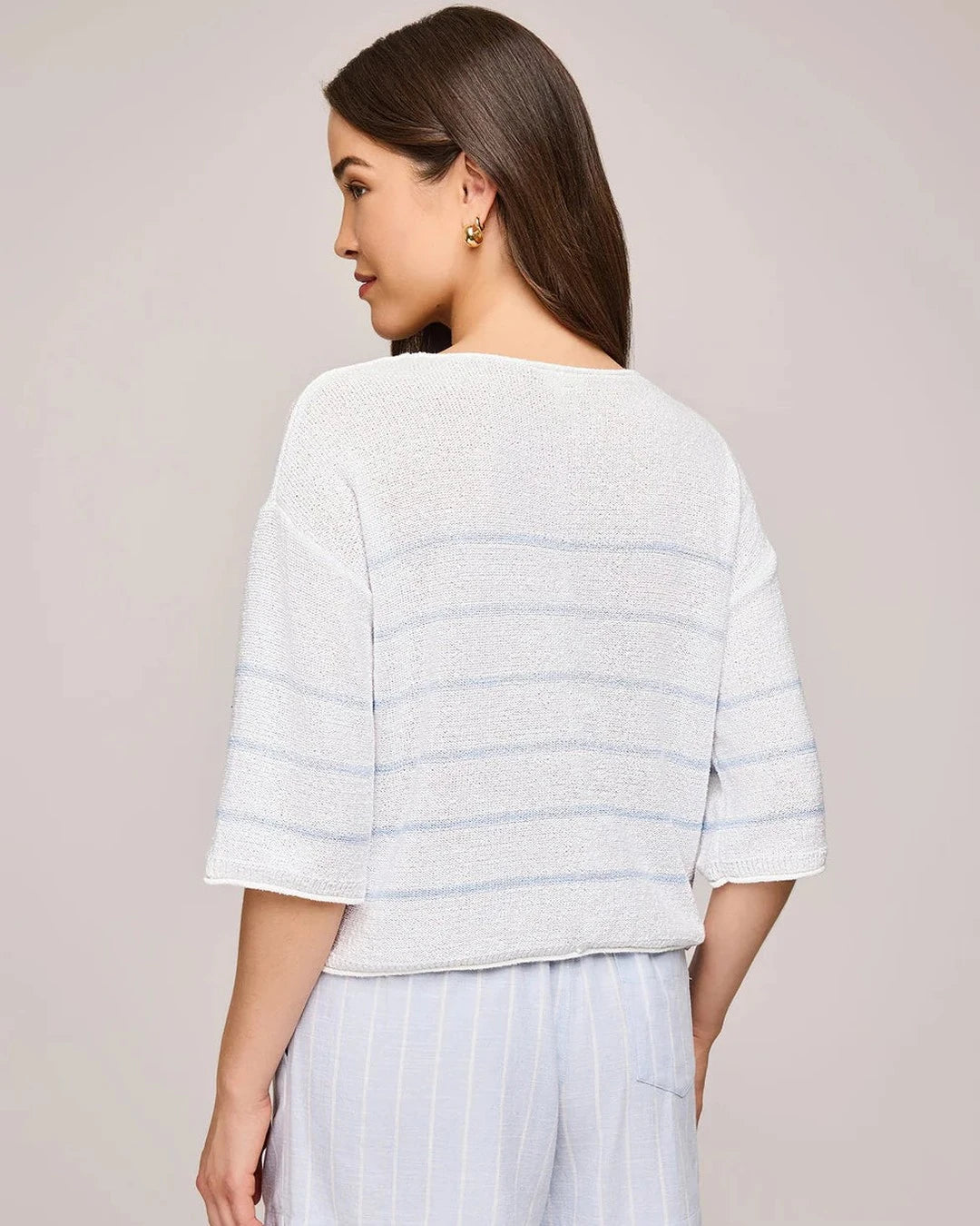 Back view of the sky blue striped Kerrigan sweater with light blue shorts