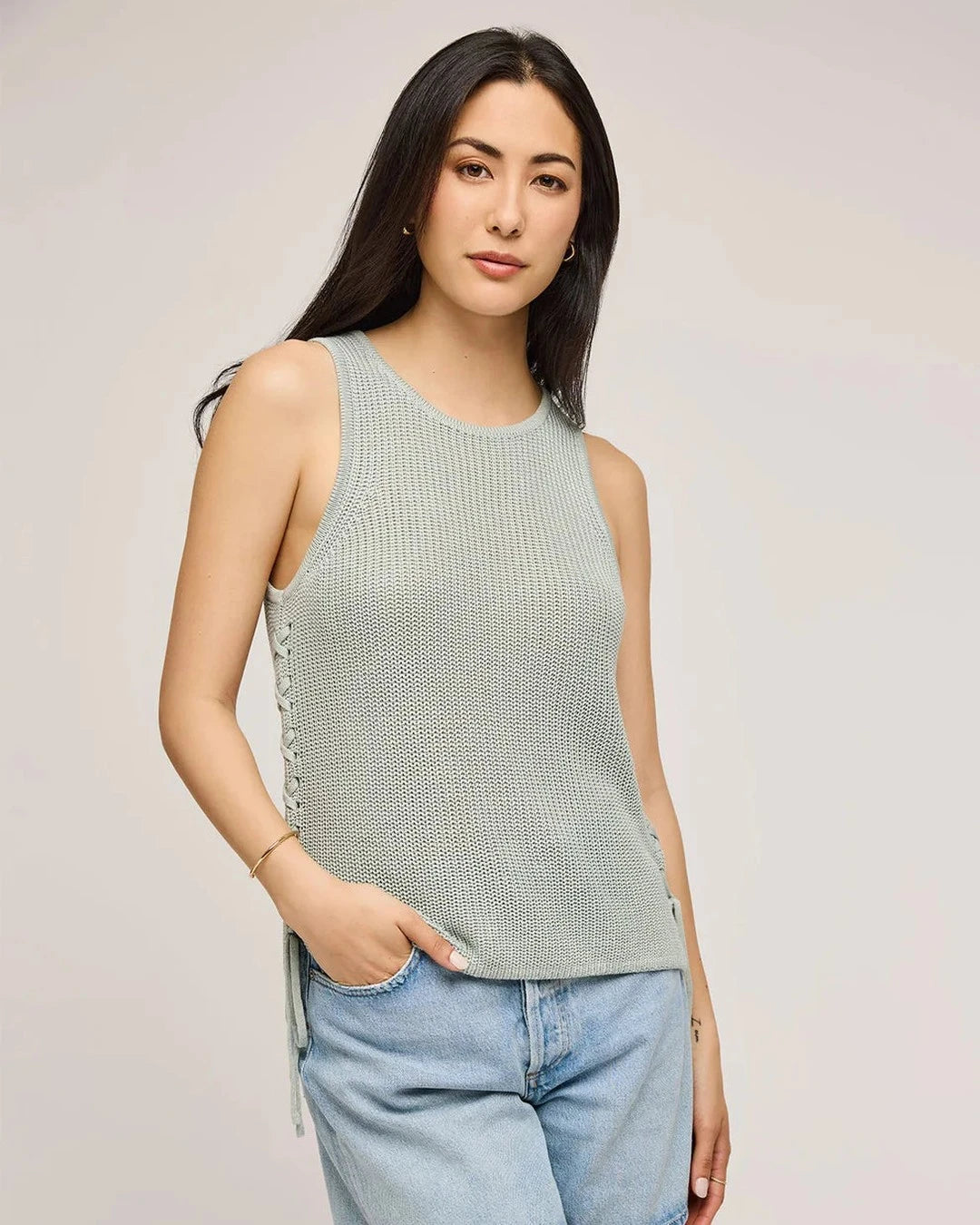 Gentle Fawn Emery Knit Sleeveless Sweater in sage green with light denim shorts, front view