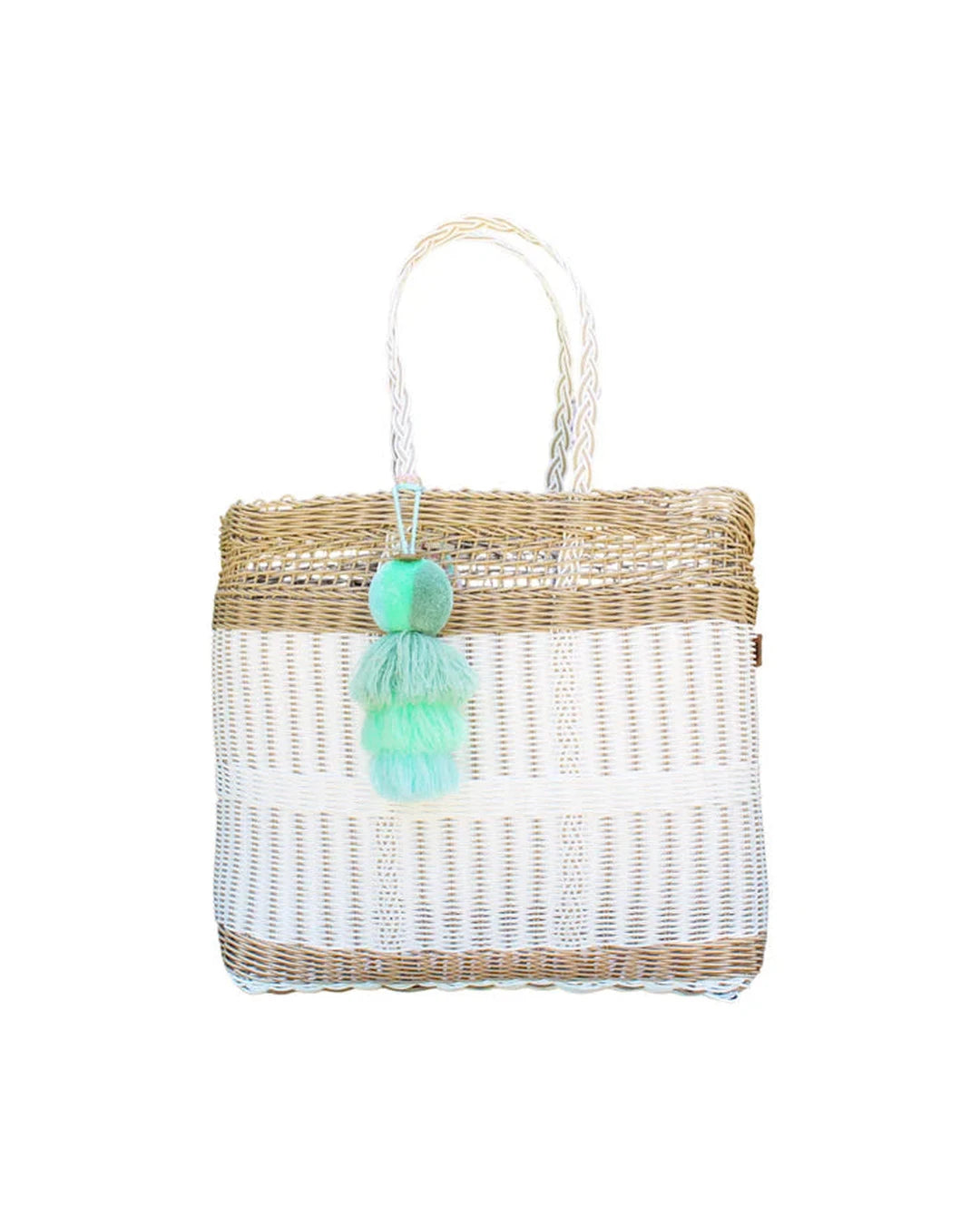 Close-up of the Coastal Net Tote showing white and tan woven bands, braided handles and fluffy mint tassel pom