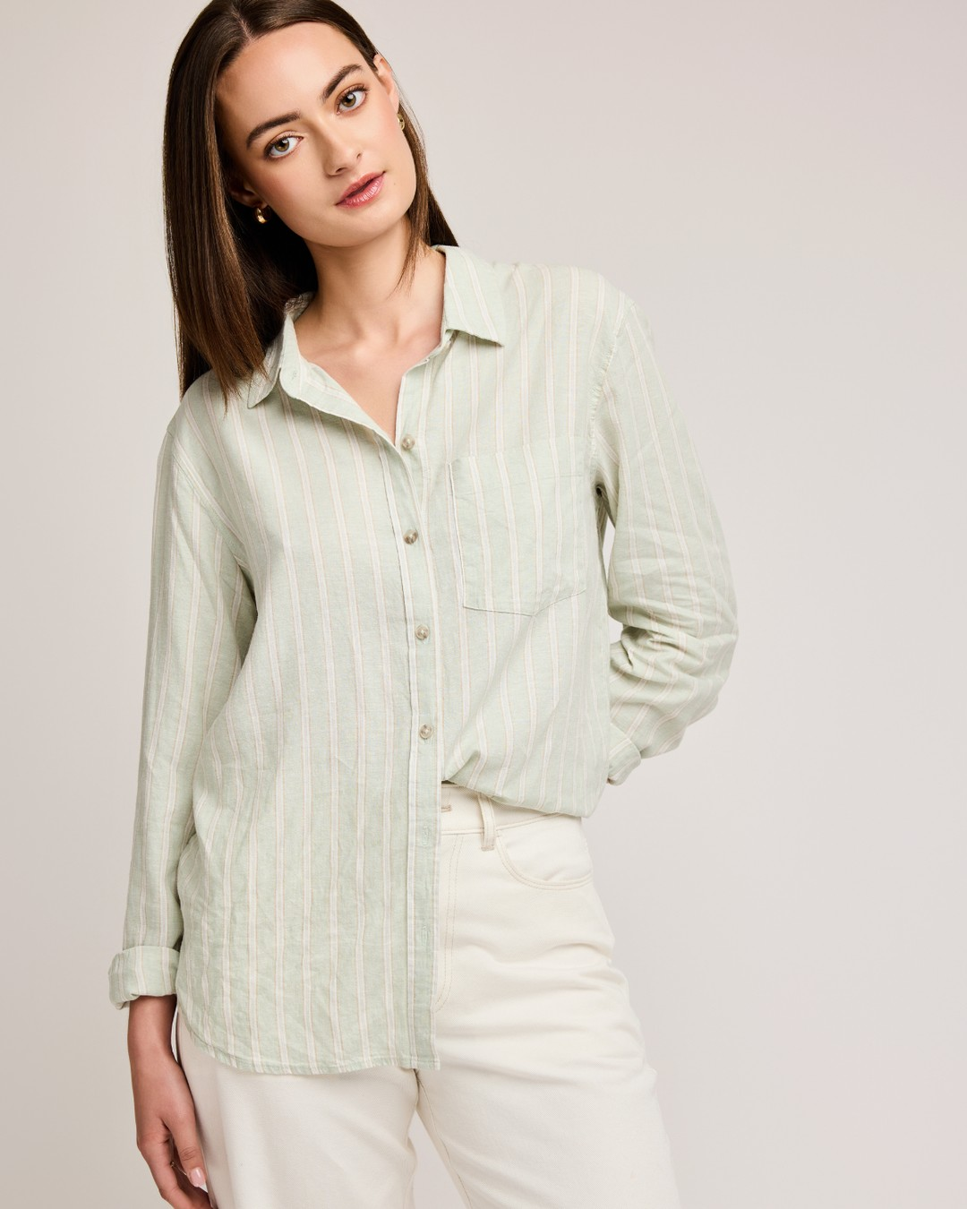 Gentle Fawn Dominique mint stripe shirt worn untucked with sleeves rolled and white jeans