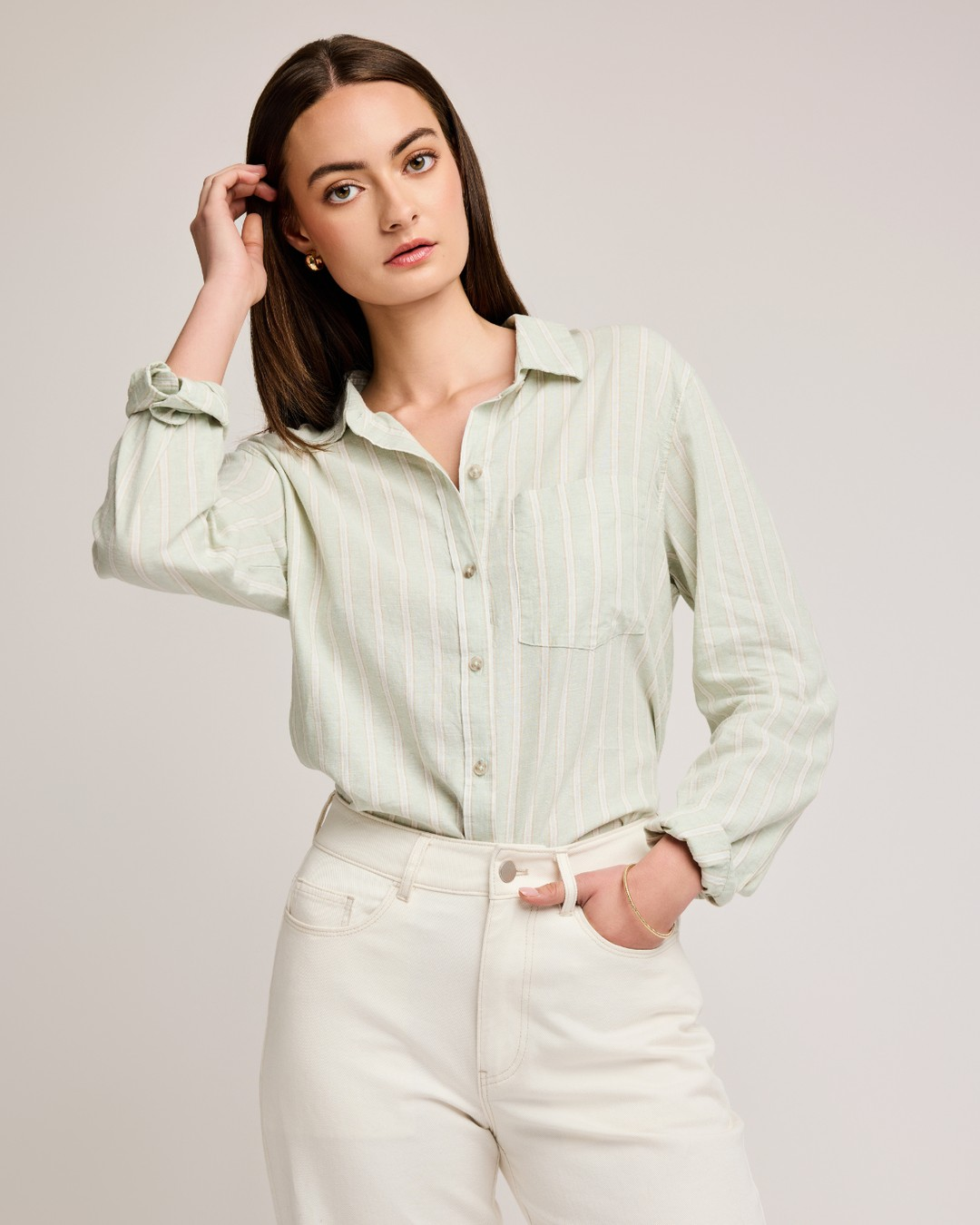 Gentle Fawn Dominique mint striped button down shirt tucked into white jeans, front view